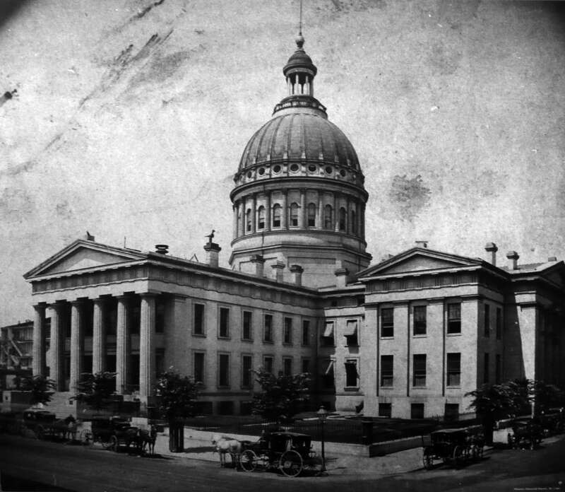 Auguste Chouteau and John Lucas donated land to St. Louis County for a courthouse in 1816. The original courthouse was constructed of brick in the Federal style of architecture and completed in 1828. A second courthouse was designed by architect