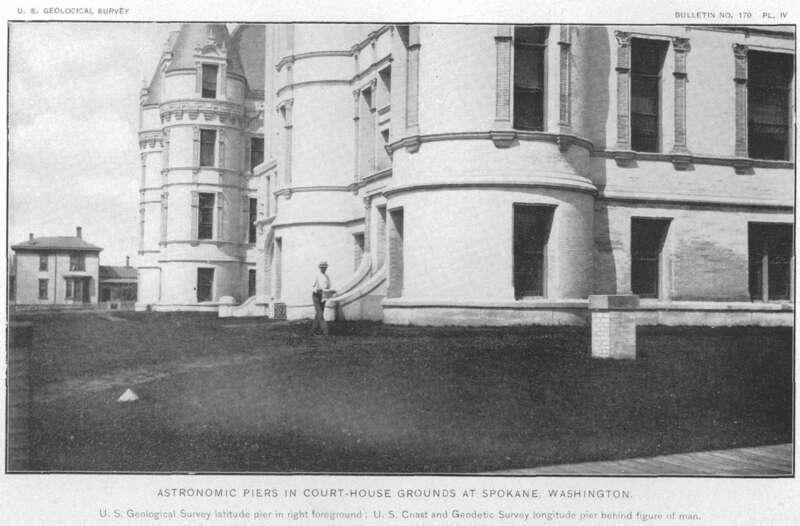 These stone monuments also known as astronomic piers next to the Spokane Courthouse cupola flagpole were used as base stations or benchmark reference points for latitude and longitude in the USGS "Survey of the Boundary Line Between Idaho and Montana