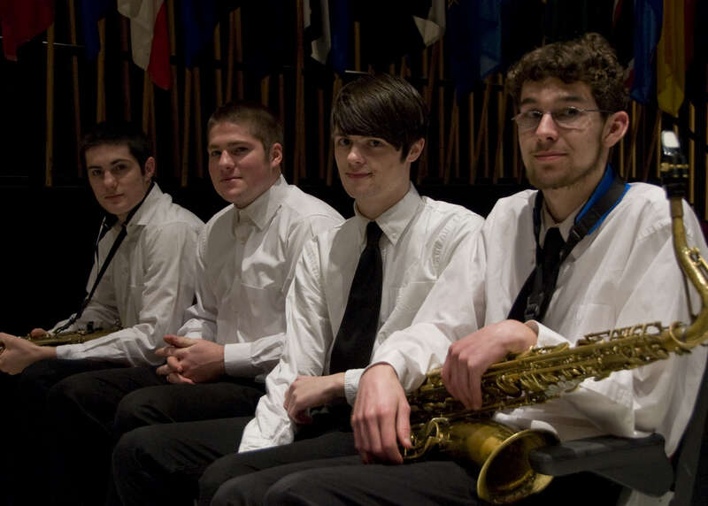 110313-N-5508A-008 Bangor, Me  (March 21, 2011) Four lucky students at Bangor High School prepare to join the Navy Band on stage for a performance of Sousa's "Washington Post March". The Navy band is currently on a 22 day tour of the Northeast US.