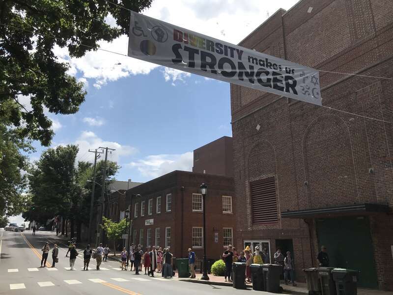 "DIVERSITY makes us STRONGER" banner hanging over the street near Emancipation Park.