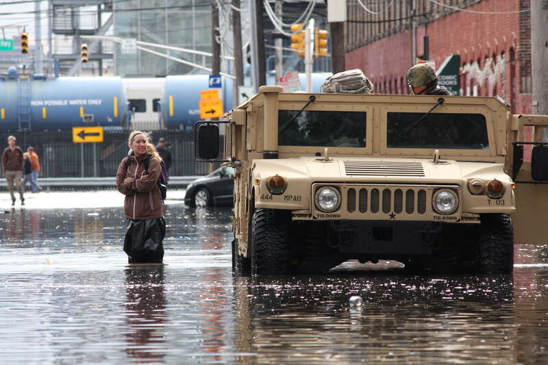 New Jersey National Guard soldiers assist displaced residents at the town of Hoboken Oct. 31. Four trucks and eight soldiers were dispatched to Hoboken at the request of the state Office of Emergency Management to assist in rescue efforts of