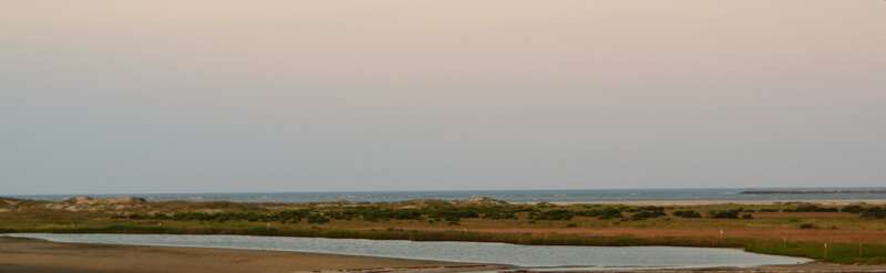 Oregon Inlet is an inlet along North Carolina's Outer Banks. It joins the Pamlico Sound with the Atlantic Ocean and separates Bodie Island from Pea Island, which are connected by a 2.5 mile bridge that spans the inlet. As one of the few access points