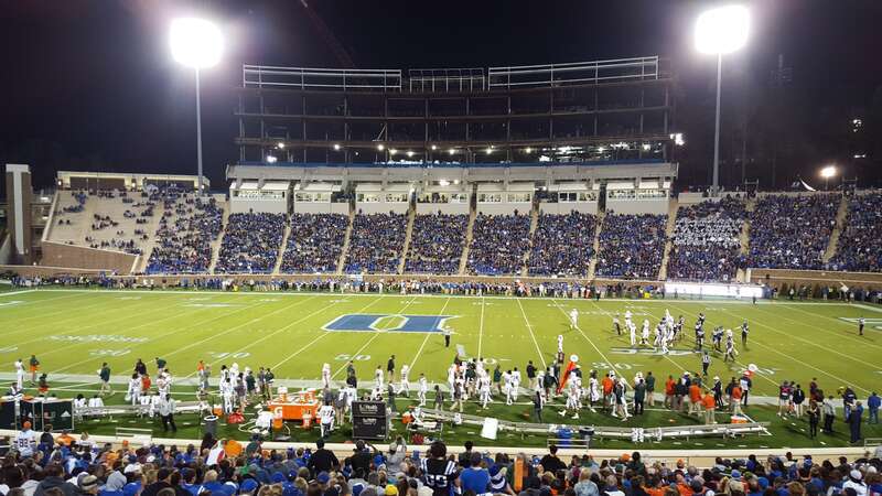 Wallace Wade Stadium during Duke's 2015 game against the Miami Hurricanes.  The construction of Blue Devil Tower can be seen above the press box.