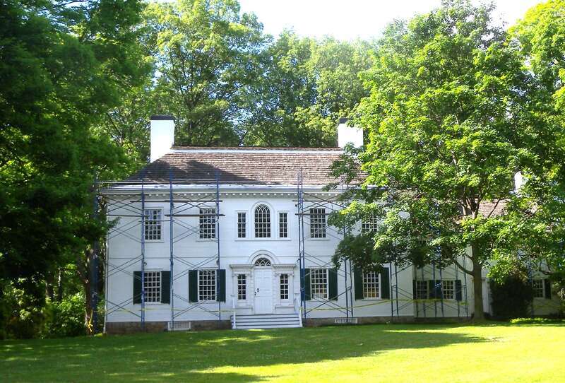 Looking north from Morris Avenue at Ford Mansion on a mostly sunny afternoon.