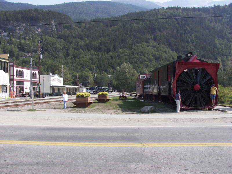 White Pass and Yukon Railroad Depot and a rotary snowplow on Broadway and Second Avenue in Skagway, Alaska.