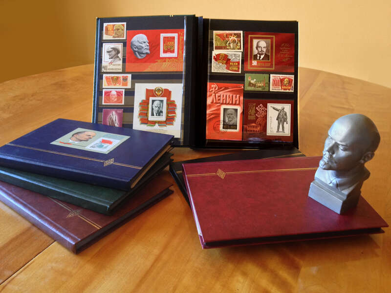 A six-volume collection of stamps from around the world featuring Vladimir Lenin. All visible stamps and miniature bust are products of the USSR government and have been released to the public domain.