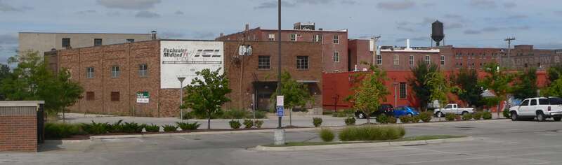 Downtown Omaha, Nebraska: view facing northeast from not far south of intersection of 14th and Izard Streets.  Most of the buildings in the photo are part of the Nicholas Street Historic District, listed in the National Register of Historic Places.