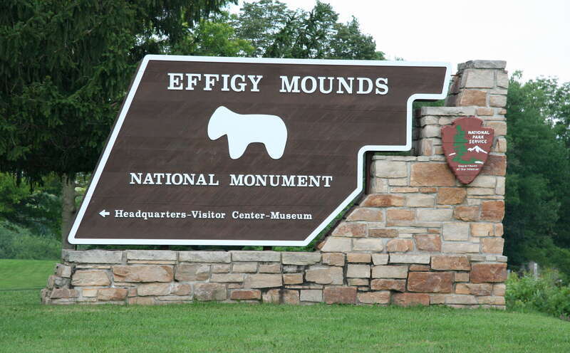 Effigy Mounds National Monument entrance sign north of Marquette, Iowa. The sign design and text are public domain works of the United States Federal Government, National Park Service.