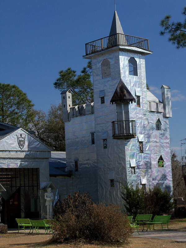 Solomon's Castle in Florida. 
"Castle" built from discarded materials and objects by an eccentric artist in swamps on Ona, Florida; walls are covered with used aluminum printing plates that reflect light.