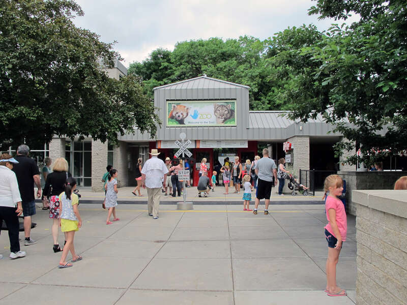Photo of the entrance to the Lincoln Children's Zoo, 1222 S. 27th Street in Lincoln, Nebraska.  Photo taken facing nearly northeast at the front gates of the zoo.  The ZO&amp;O Train Depot can be partially seen on the right (with the backside of the