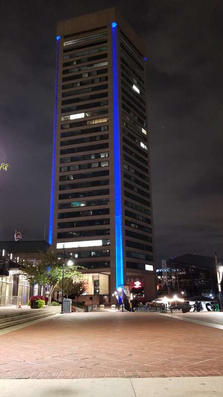 Baltimore World Trade Center lit up in blue.