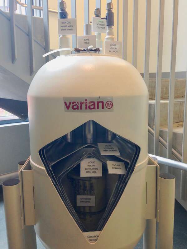 Cutaway of an NMR magnet at the Johns Hopkins University that shows its structure: radiation shield, vacuum chamber, liquid nitrogen vessel, liquid helium vessel, and cryogenic shims.