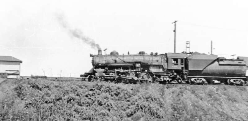 Glimpsed from my passing train, a Baltimore &amp; Ohio 2-8-4 is switching in the Yards at Washington D.C. In 1952 the B&amp;O were still using quite a number of steam locomotives.
