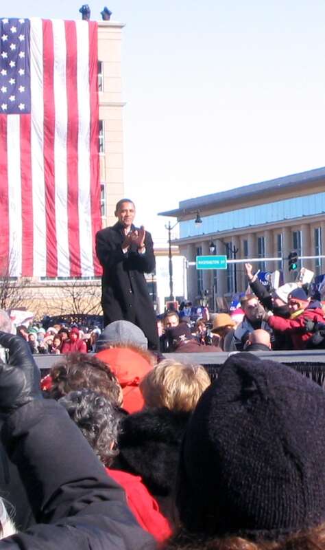 Walking on to music from U2, Obama waved and smiled to the crowd.