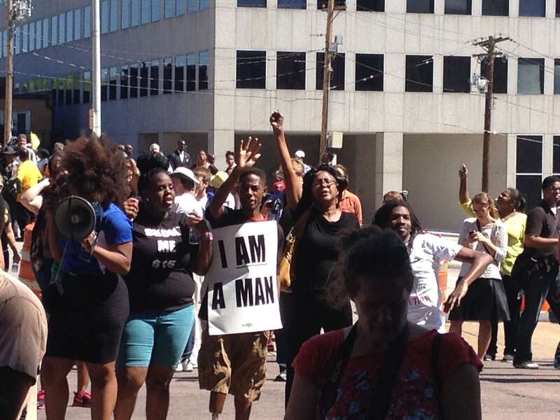 Carrying signs.