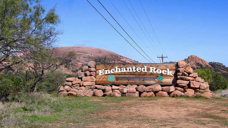 The entrance sign of Enchanted Rock State Natural Area in Gillespie County, Texas, United States.