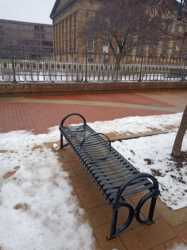 Bench south of Old State Capitol in Springfield, Illinois, designed to deny homeless residents of the city a place to sleep.