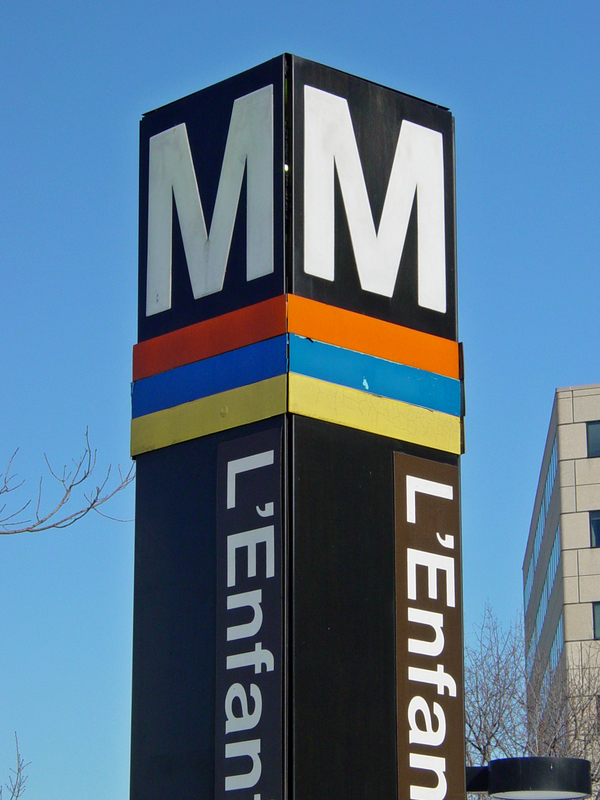 Street pylon at the 7th Street and Maryland Avenue SW entrance to L'Enfant Plaza station.  Note that the pylon only contains stripes for the Orange Line, Blue Line, and Yellow Line.  This pylon would finally receive a Green Line stripe in 2004.

Ben