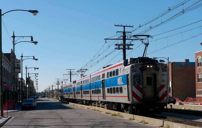 A Metra Electric train running in 71st Street passed our tour many times