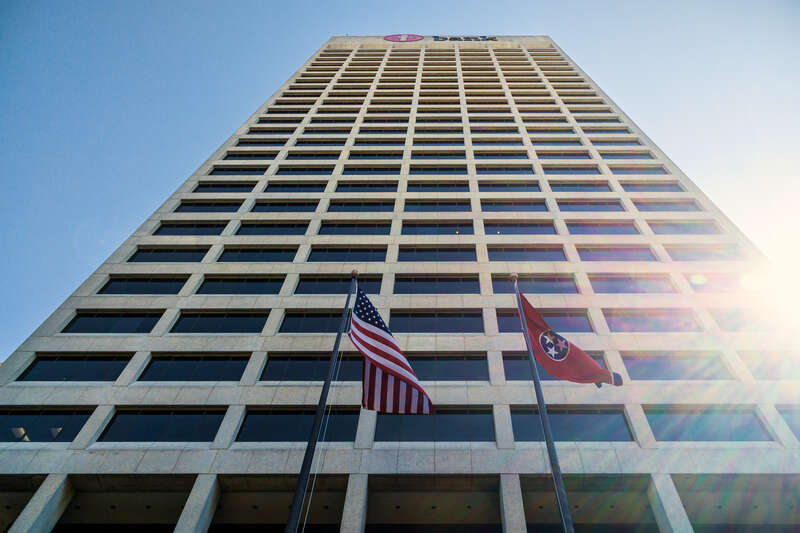 American and Tennessee flags in front of One Commerce Square, aka "iBank Tower", downtown Memphis Tennessee