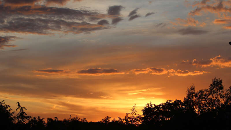 500px provided description: I was out mowing, and looked up as the light was glowing.  I had to run inside for my camera.  The cloud layers and textures drew my attention. [#sky ,#landscape ,#sunset ,#nature ,#sun ,#evening ,#outdoors ,#dusk ,#fair