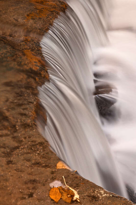 Close-up long exposure waterfall from Swallow Falls State Park in Maryland, USA. HDR composite from multiple exposures. 

This photo is released under a standard Creative Commons License - Attribution 3.0 Unported. It gives you a lot of freedom to