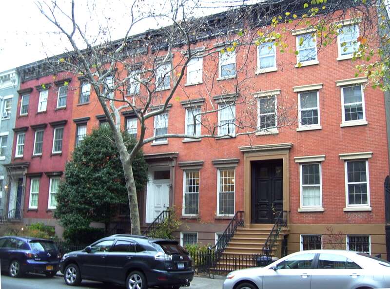 From right to left, 319-325 West 19th Street, between Eighth and Ninth Avenues, in the Chelsea neighborhood of Manhattan.