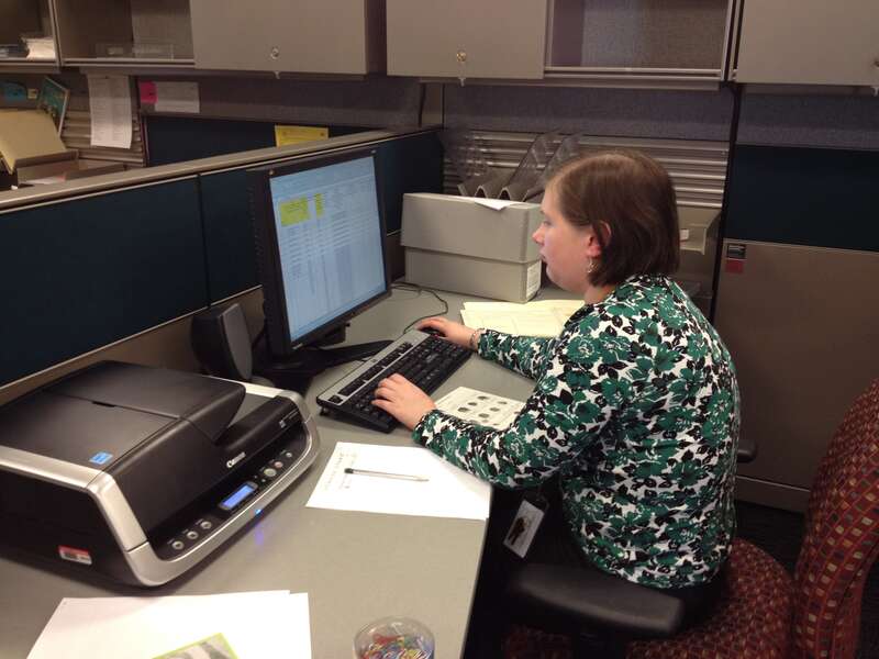 Laura Gentry (intern) in staff office space; Location: National Archives at Kansas City - RMKC Staff Office, Kansas City, MO; Photographer: Elizabeth Burnes