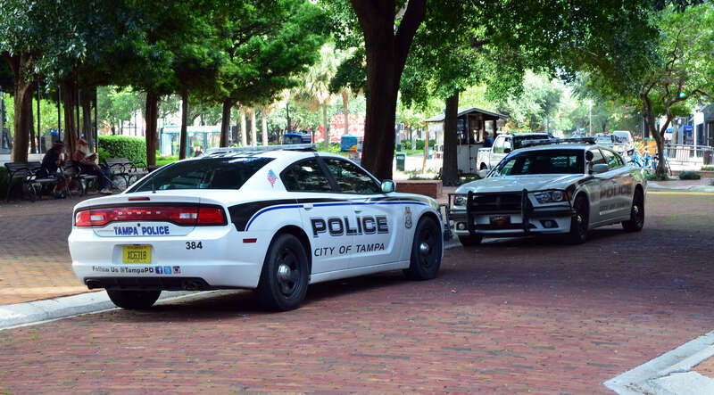 Two Tampa Police Dodge Chargers each other with front views. (Florida, USA).