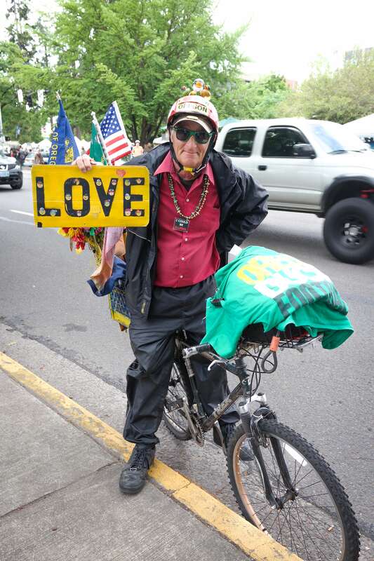 A bicyclist with a message at the Saturday Market in Eugene, Oregon