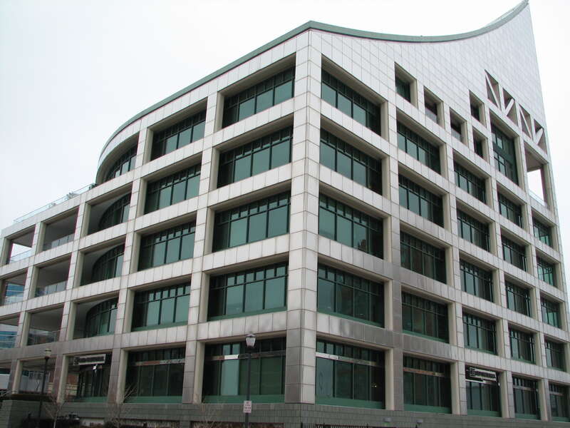 Photo by Cecilia P.-
I have always appreciated the silhouette of this building including its stainless steel panels and columns. I had initially thought that this was probably a good example of the White school until I passed to photograph it. It
