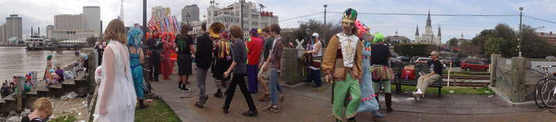 Mardi Gras Day  in New Orleans:  Society of St Anne at the Moonwalk on the French Quarter Mississippi River front.