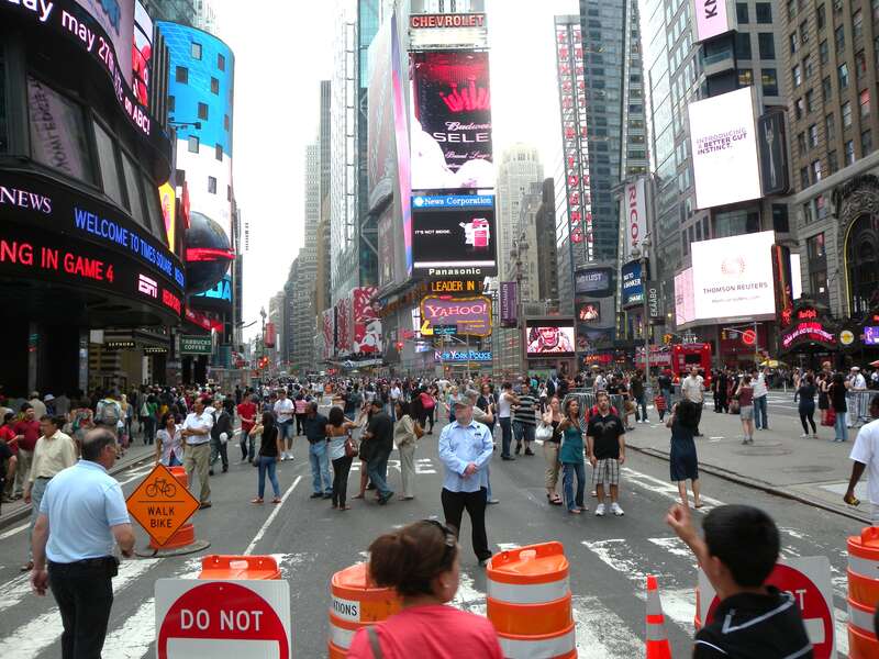 Looking south along pedestrianized (merely closed to cars, not yet renovated) Broadway through Times Square on a sunny afternoon.
