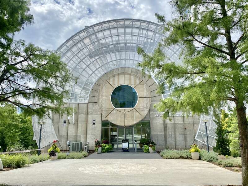 Built in 1983-1985, this Modern building was designed by Conklin and Rossant as part of the construction of the Myriad Botanical Gardens, which began construction in 1971.  The building consists of a large cylinder that is 224 feet (68 meters) long