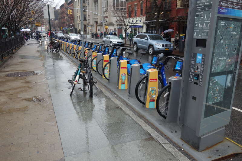 A CitiBike rack in front of Father Demo Square at 6th Avenue and Carmine Street in Greenwich Village, Manhattan.