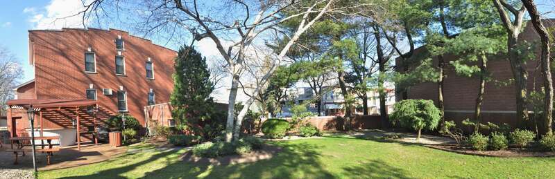 Louis Armstrong House, now a museum, 34-56 107 St., Corona, Queens, NY. View from (and of) the garden that was installed right at the end of his life.