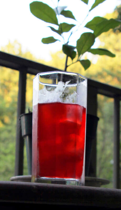 A cocktail known as an "Alabama Slammer": 1 oz. amaretto 1 oz. Southern Comfort 1/2 oz. sloe gin Dash lemon juice Pour over ice cubes and stir. My little lemon tree is in the background.