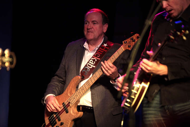 Former Governor Mike Huckabee performing for supporters at a campaign rally featuring country musician Josh Turner at Wooly's in Des Moines, Iowa.

Please attribute to Gage Skidmore if used elsewhere.