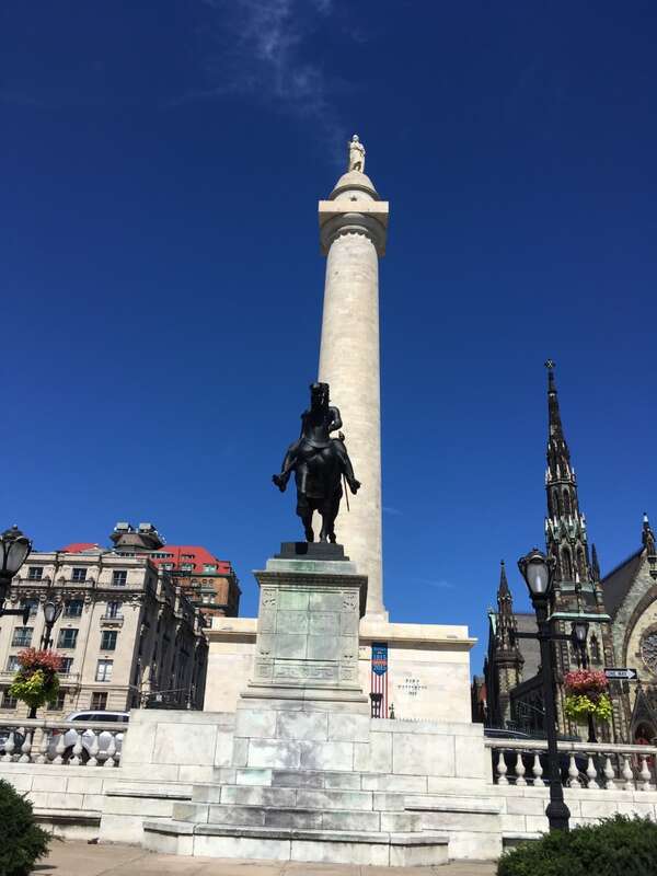 178 feet 8 inches tall, made of white marble