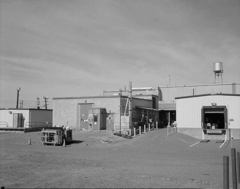 1. South and east facades of 232-Z (2736-ZB in rear). Looking north. - Plutonium Finishing Plant, Waste Incinerator Facility, 200 West Area, Richland, Benton County, WA