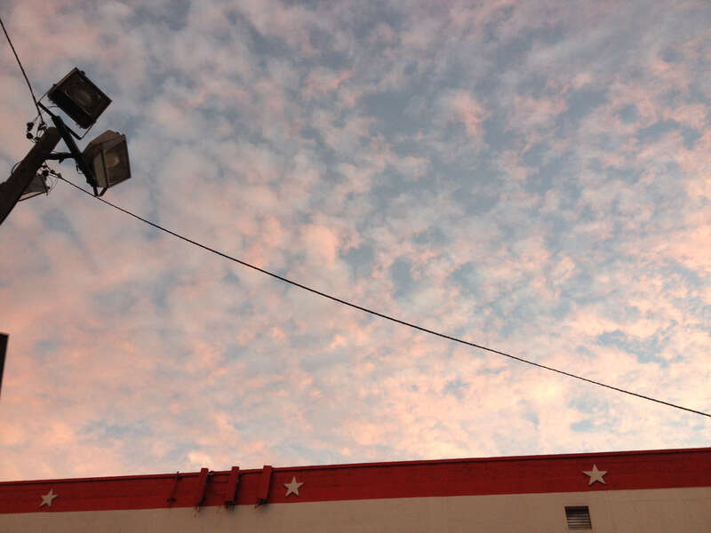 Cloud formations reflecting the sunset after a partly raining partly sunny day, taken while facing east in the parking lot of the American Self-Storage facility at 190 Baldwin Avenue in Jersey City, New Jersey.

This photo was created by Luigi Novi.