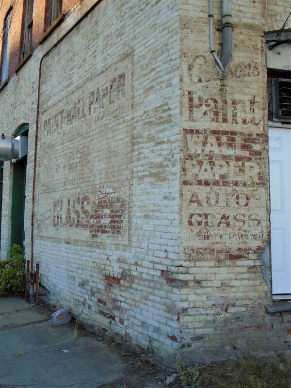 Wall painting advertisement on the facade of 15 Washington Street in Gloversville, New York.