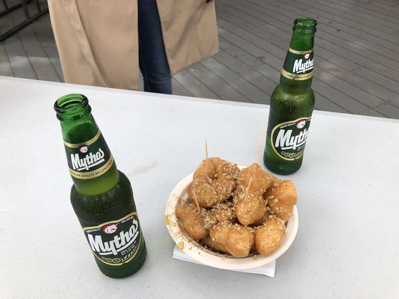 Loukoumades and two bottles of Mythos beer at the 2019 Marin Greek Festival in Novato, California