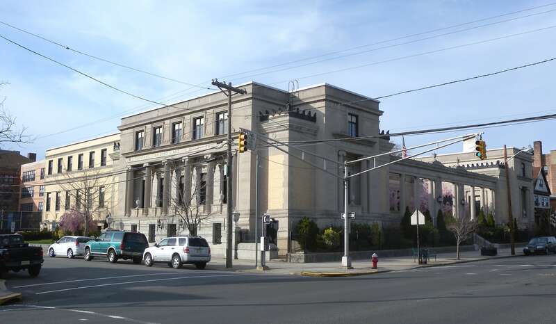 Looking north across Avenue C at Bayonne Free Public Library on a sunny afternoon.