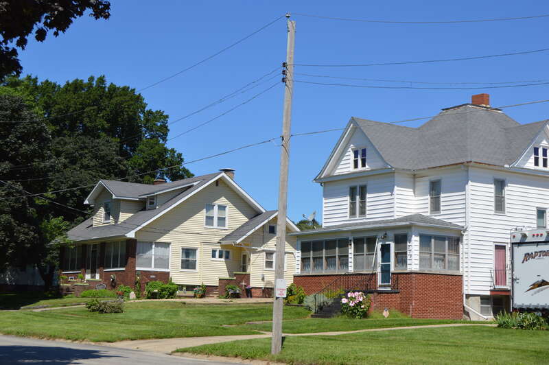 Houses on the northern side of Broad Street, seen looking west from the Jefferson Street intersection, in Roanoke, Illinois, United States.