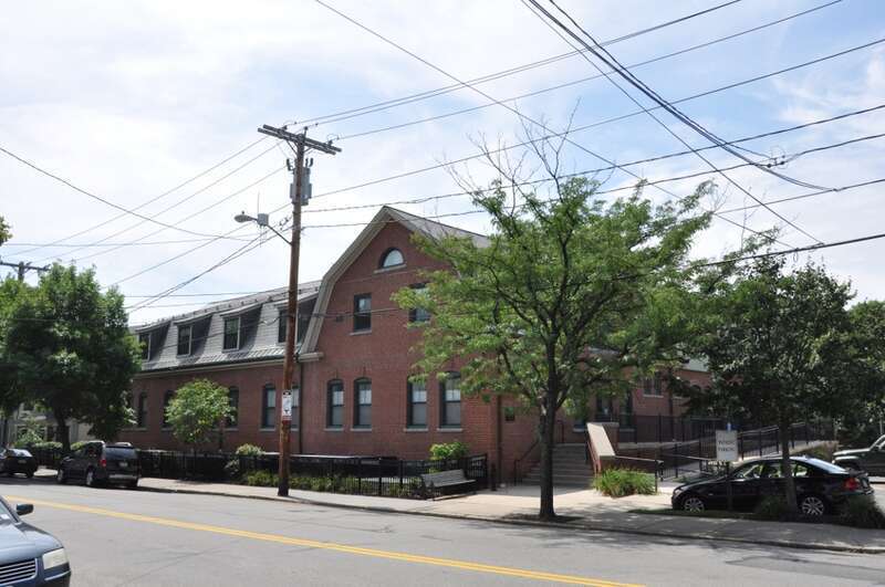 A photograph of the historic Town Stable in Brookline, Massachusetts.