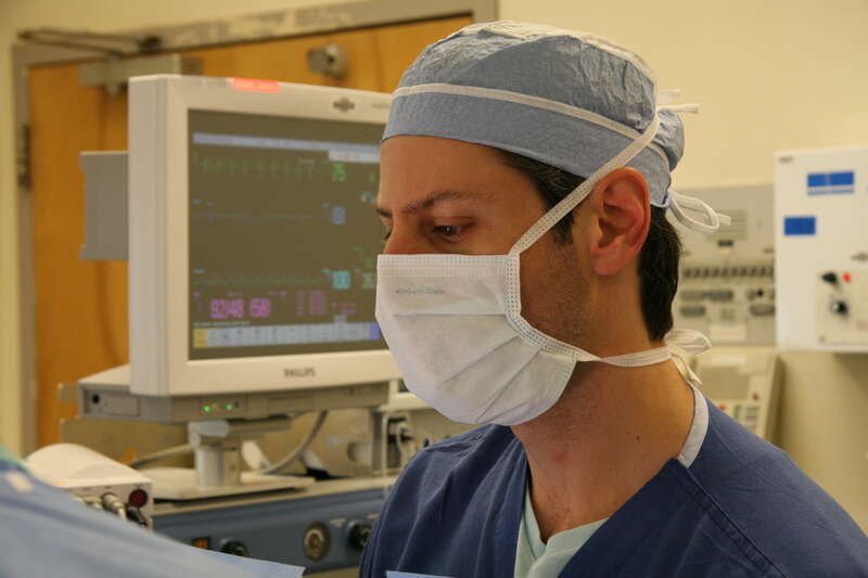 A medical professional wearing a surgical mask during surgical operation to remove a hemangioma (at the California Pacific Medical Center).