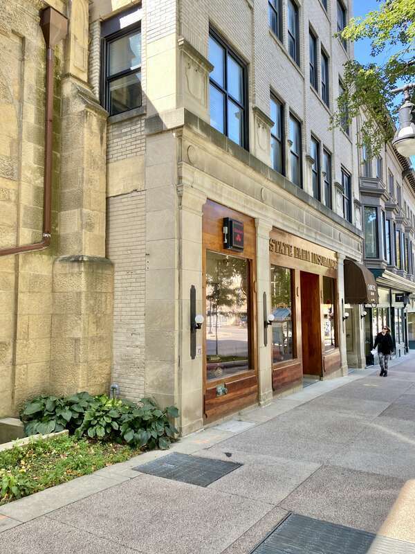 Built in 1914-1915, this Classical Revival-style skyscraper was designed by James R. Law and was originally known as the Gay Building.  The building is clad in cream-colored brick with limestone trim, limestone pilasters and a limestone architrave