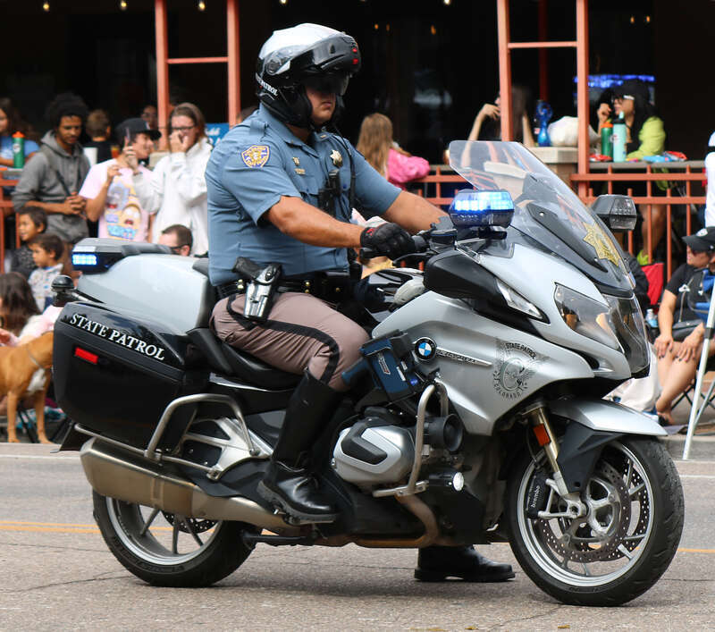 A Colorado State Patrol motorcycle participating in the 2023 Colorado State Fair parade in Pueblo, Colorado. The bike is a BMW model R 1250 RT.