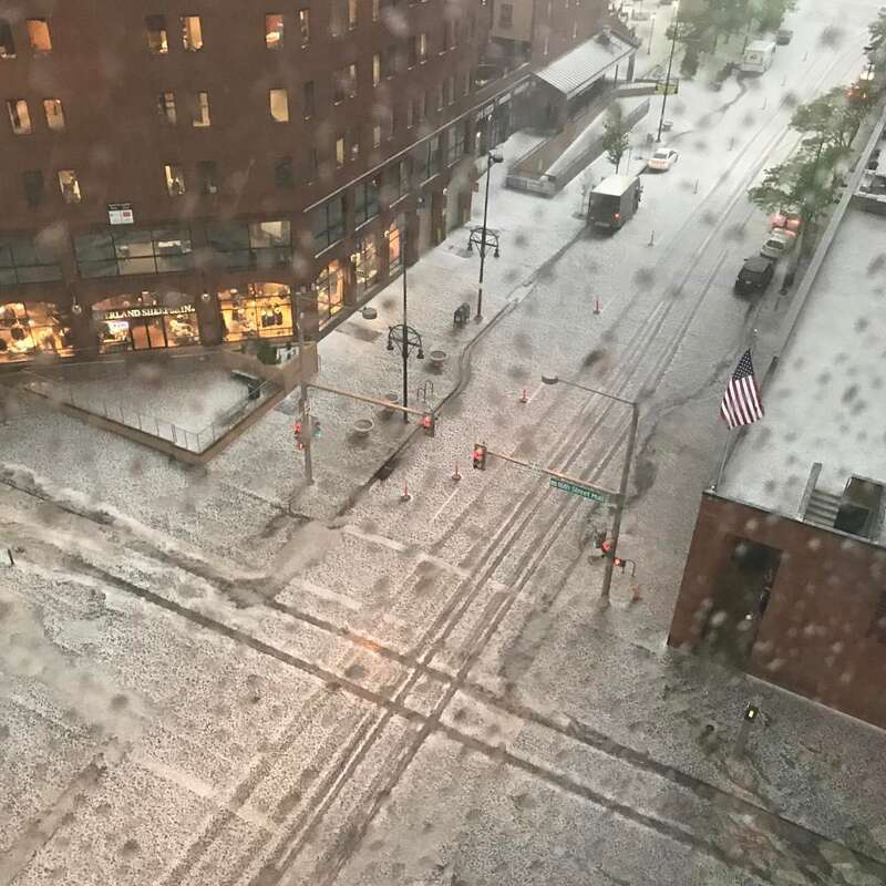 Streets in downtown Denver, Colorado under hail storm.